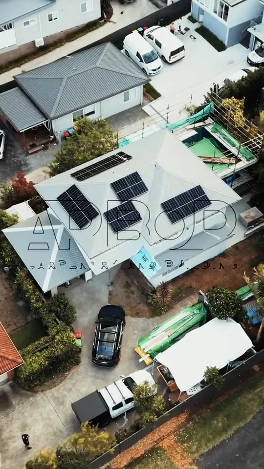 Aerial view of the renovated house and street