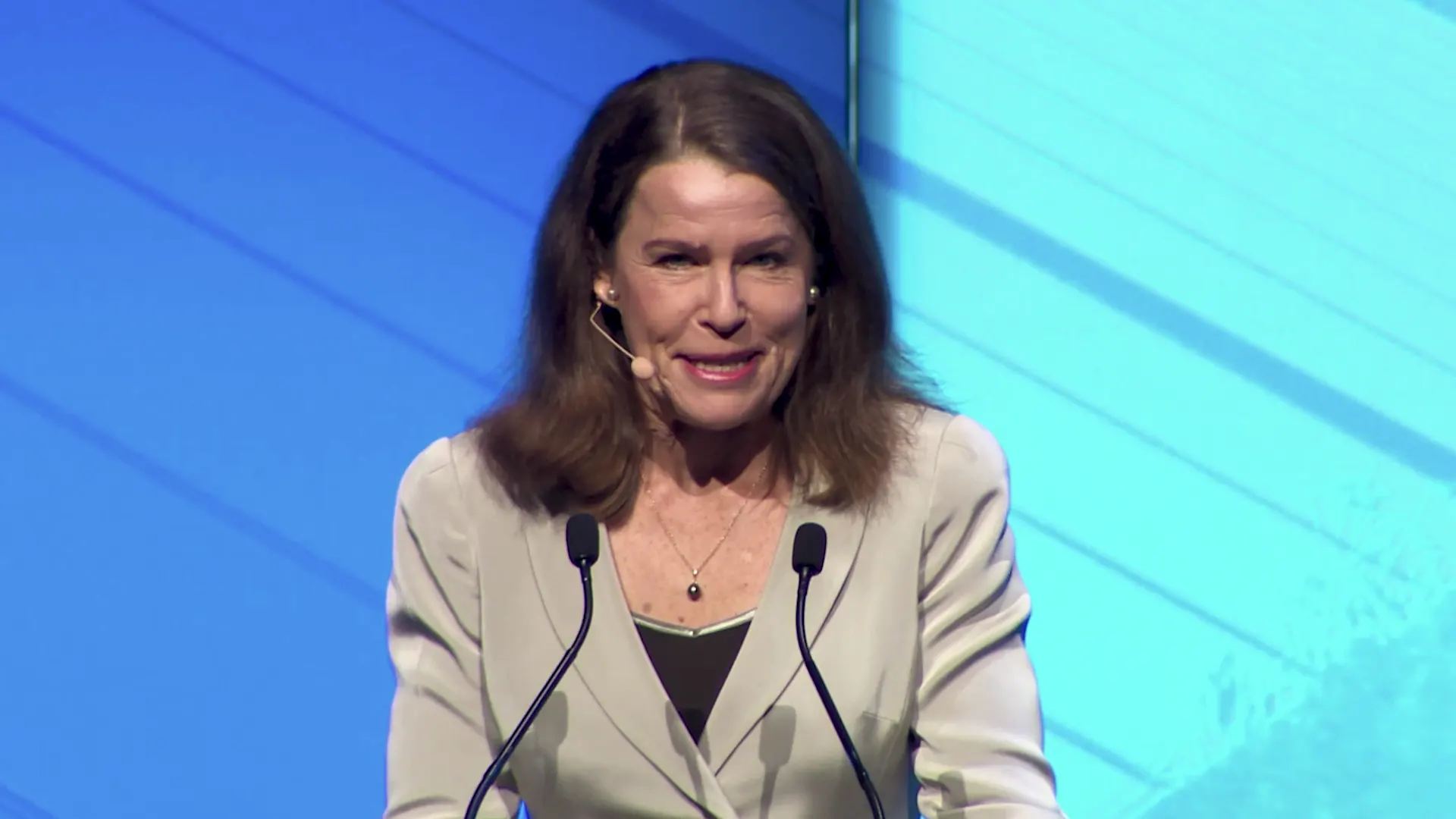 A keynote speaker on stage at the Australian Governance Summit