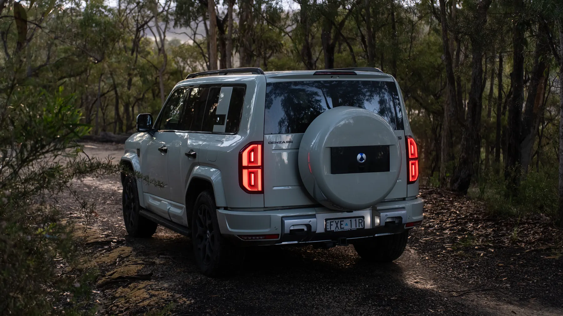 DENZA B5 Leopard, rear three-quarter showing the tailgate-mounted spare wheel